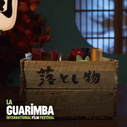 A Wooden Box With Chinese Writing On It And The Words La Guarimba International Film Festival GIF