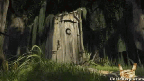 A Wooden Outhouse In The Middle Of A Forest With A Cat Standing In Front Of It . GIF