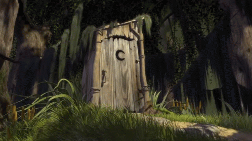 A Wooden Outhouse With A C On The Door GIF