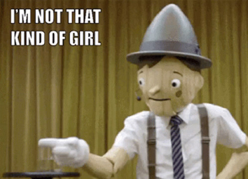A Wooden Puppet Says I 'M Not That Kind Of Girl While Pointing A Gun GIF