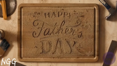 A Wooden Tray With The Words Happy Father 'S Day Written On It GIF