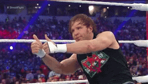 A Wrestler Giving A Thumbs Up In A Ring GIF