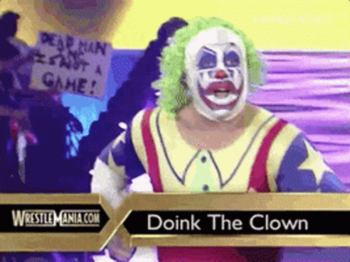 A Wrestler In A Clown Costume Is Standing In Front Of A Sign That Says " Dead Man Is Not A Game " GIF