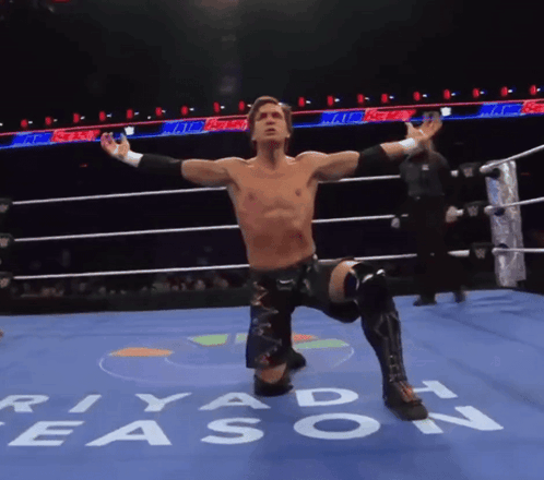 A Wrestler In A Ring With The Word Riyadh Written On The Floor GIF