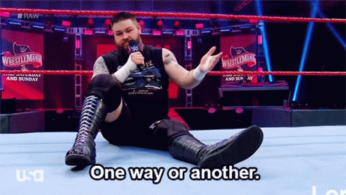 A Wrestler Is Sitting On The Ground In A Wrestling Ring Talking Into A Microphone And Says One Way Or Another GIF
