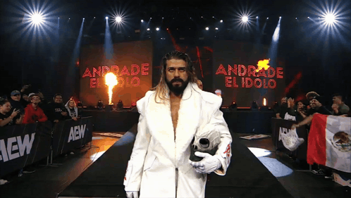 A Wrestler Named Andrade El Idolo Walks Down A Ramp GIF