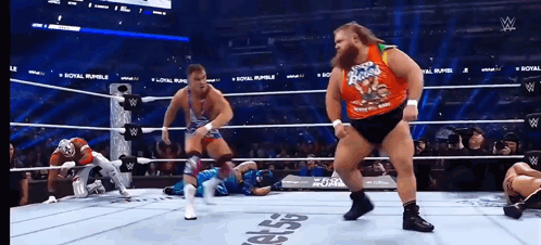 A Wrestler Wearing A Shirt That Says ' Rocky Road ' On It GIF