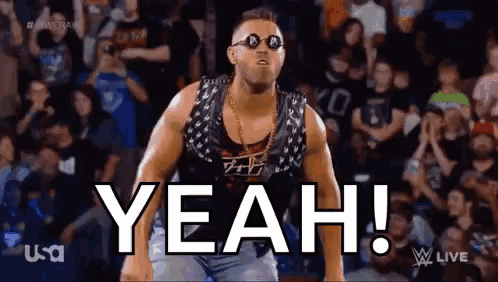 A Wrestler Wearing Sunglasses And A Vest Is Standing In Front Of A Crowd And Says Yeah . GIF