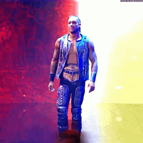 A Wrestler With A Belt That Says ' Intercontinental Heavyweight Champion ' On It GIF