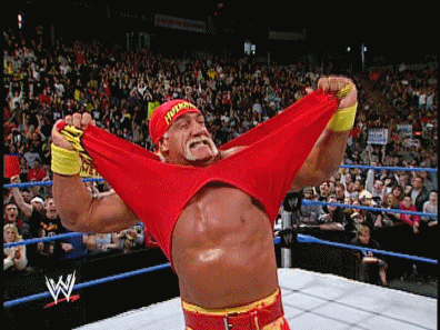 A Wrestler With A Red Shirt That Says Hulk Hogan On It GIF