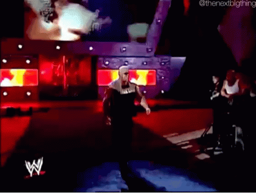A Wrestler With The Word Hulk On His Shirt Walks Down The Ramp GIF