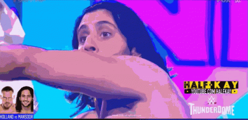 A Wrestling Match Between Holland And Mansoor Is Being Broadcasted On Youtube GIF
