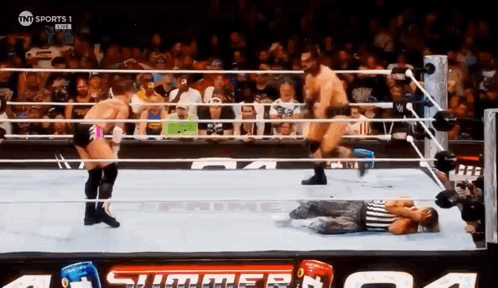 A Wrestling Match Is Being Broadcast On Tnt Sports GIF