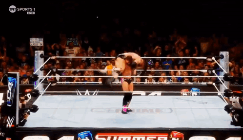 A Wrestling Match Is Being Shown On Tnt Sports GIF