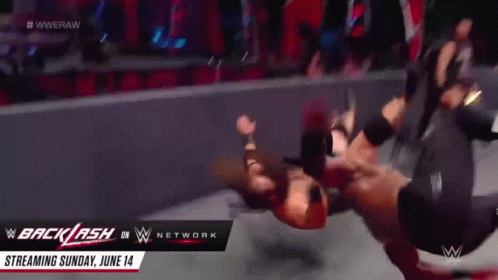 A Wrestling Match Is Being Streamed On The Wwe Network GIF