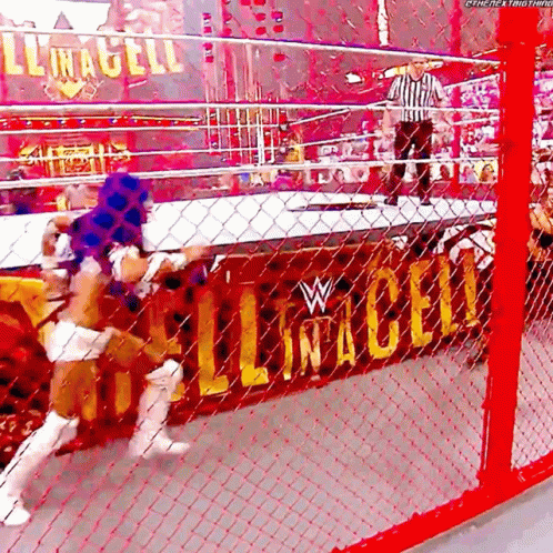 a wrestling match is going on in a ring with a sign that says ' lincoln ' on it