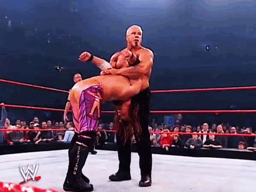 A Wrestling Match With A W Logo On The Ring GIF
