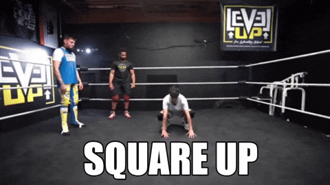 a wrestling ring with a sign that says level up on it