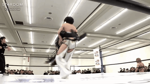 A Wrestling Ring With A Sign That Says Stardom GIF
