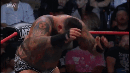 A Wrestling Ring With Aaw Written On The Side GIF