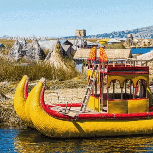 A Yellow And Red Boat With The Word Yonhy Lescano On The Bottom Right GIF