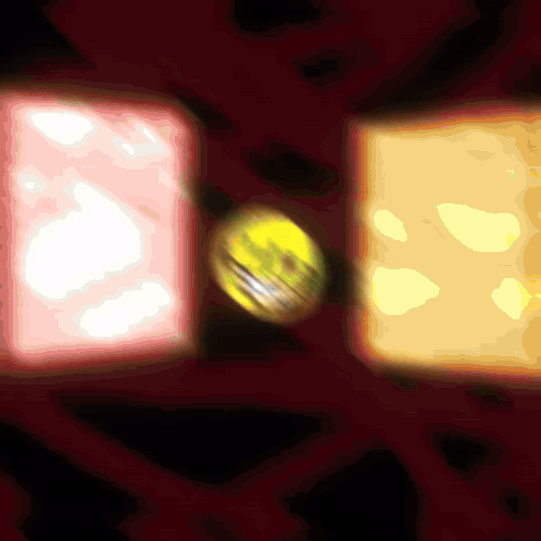 A Yellow Ball Is In The Middle Of A Red Circle GIF