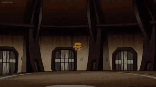A Yellow Ball With A Face On It Is Spinning In A Cartoon . GIF