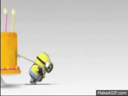 A Yellow Birthday Cake With Candles And The Words Happy Birthday On The Bottom GIF