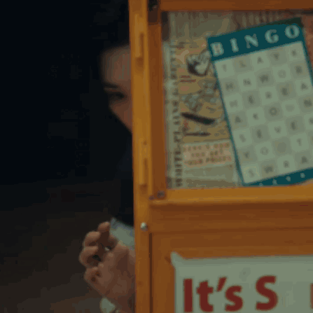 A Yellow Box With A Bingo Board On It GIF