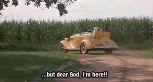 a yellow car is driving down a dirt road and says but dear god i 'm here !