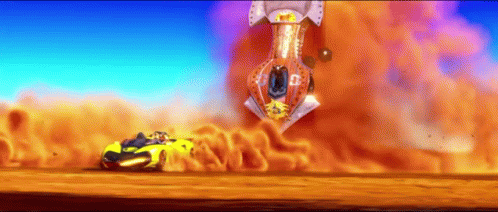 A Yellow Car Is Driving Down A Dirt Road In Front Of A Huge Explosion GIF