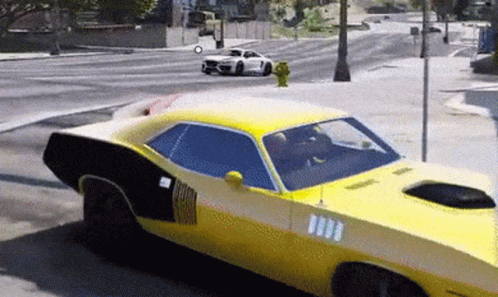 A Yellow Car Is Driving Down A Street With A White Car Behind It GIF