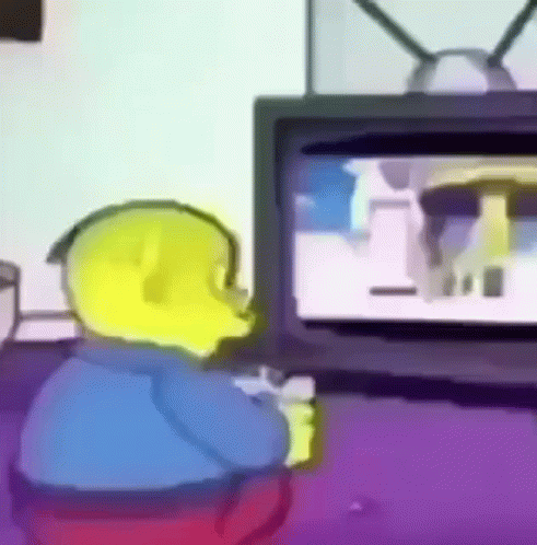 A Yellow Cartoon Character Is Sitting In Front Of A Television . GIF