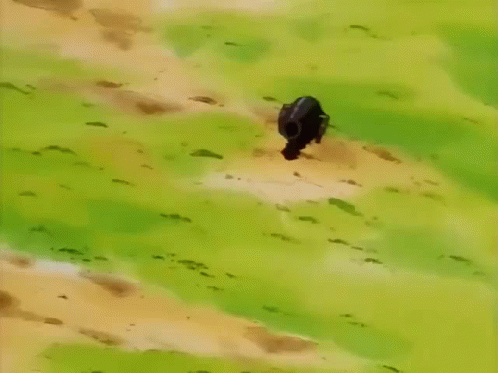 A Yellow Cartoon Character With Red Cheeks Is Laying On The Ground . GIF