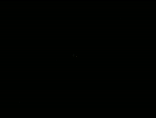 a yellow circle with a green light in the middle