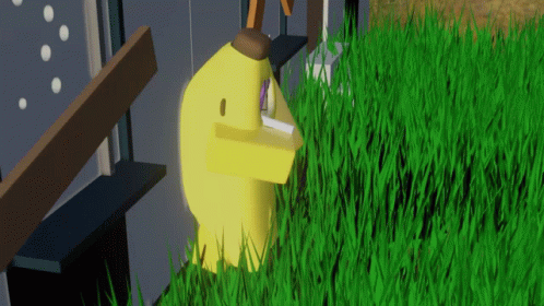 A Yellow Duck Is Standing In A Field Of Tall Grass GIF