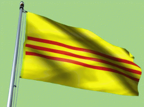 a yellow flag with red stripes on it is flying in the wind