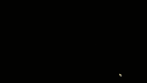 A Yellow Light Is Shining On A Black And Gold Hexagon Patterned Background GIF