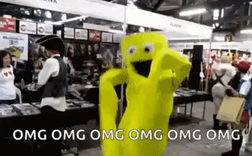 A Yellow Mascot Is Dancing In A Room With People Standing Around . GIF