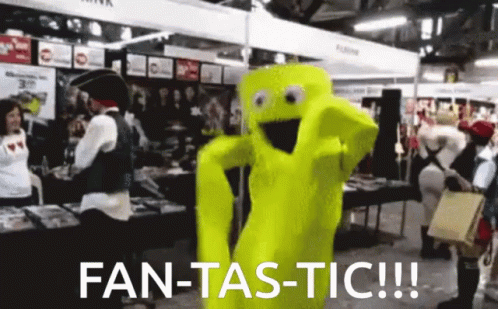 A Yellow Mascot Says Fan-Tas-Tic In Front Of A Crowd Of People GIF