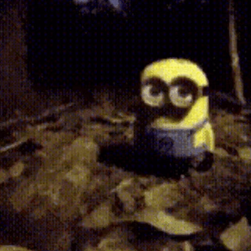 A Yellow Minion With Glasses And The Number 3 On His Face GIF