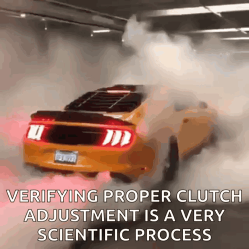 A Yellow Mustang Is Driving Through A Parking Garage With Smoke Coming Out Of The Exhaust Pipes GIF