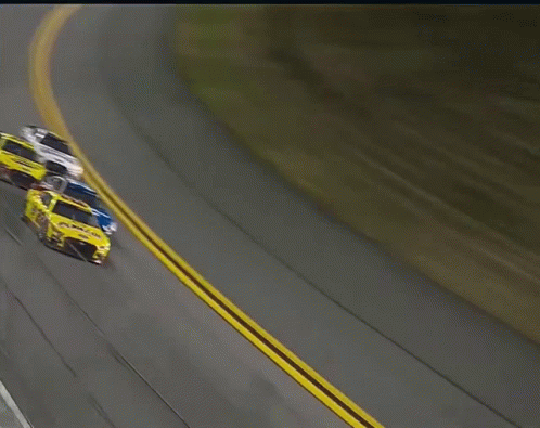 A Yellow Race Car With The Number 22 On The Side GIF