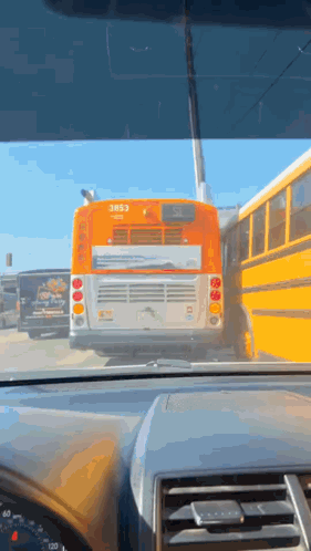 A Yellow School Bus With The Number 3853 On The Back GIF