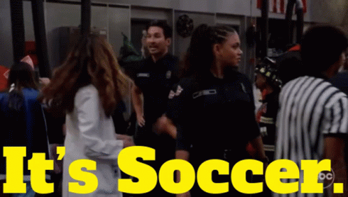 A Yellow Sign That Says It 'S Soccer With A Group Of People GIF