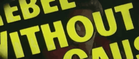 A Yellow Sign That Says Rebel Without Cause On It GIF