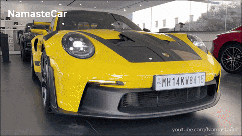 A Yellow Sports Car With A License Plate That Says Mh14kw8415 GIF