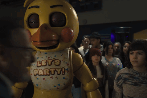 a yellow stuffed animal with the words let 's party on its chest