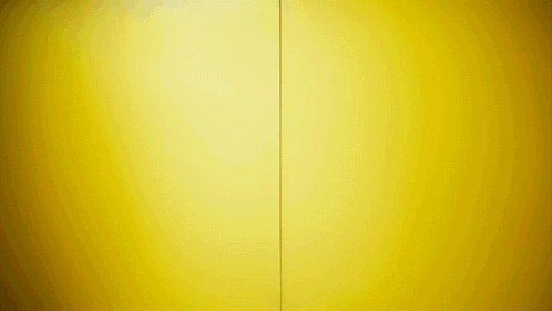 A Yellow Wall With A Red Stripe On The Bottom GIF