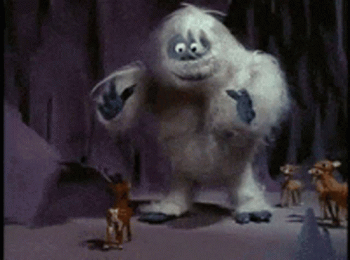 A Yeti Standing Next To A Reindeer In The Snow . GIF